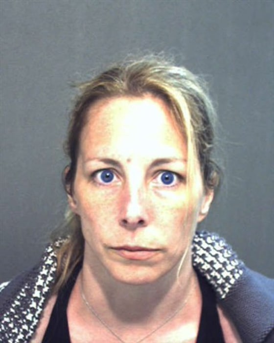 Bonnie Sweeten, shown in image from the Sheriff's Department in Orange County, Fla., faces charges in connection with the theft of hundreds of thousands of dollars from clients and colleagues at the law office where she worked.